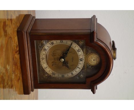 Elliott mahogany cased mantel clock retailed by Asprey & Co, of small Georgian bracket clock form, the arched brass dial with