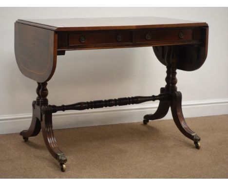 Regency style cross banded and inlaid mahogany sofa table, with two drawers, turned supports, single stretcher, reeded splaye