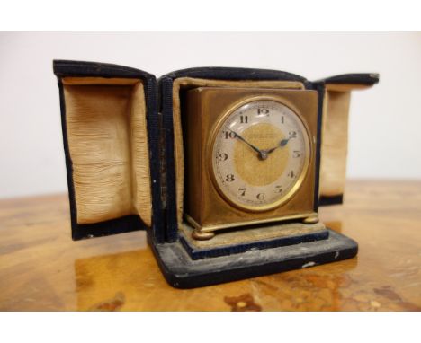 Art Deco small gilt brass cased travelling clock by Zenith, c1930, the silvered chapter ring with Arabic numerals, fixed key 