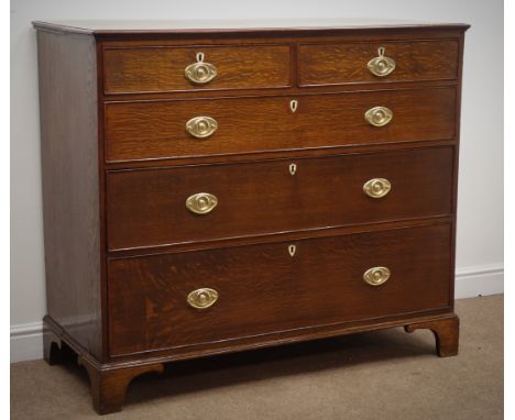 George III oak chest of two short and three long drawers, original oval brass plate handles, shaped bracket supports, W126cm,