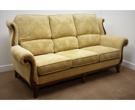 Three seat sofa upholstered in pale gold fabric with mahogany facias (W210cm) and matching two seater Condition Report Click 