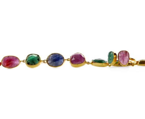 GEM SET RING AND BRACELET, set with faceted rubies, sapphires and emeralds, 17.5cm long, silver gold plated, along with a rub