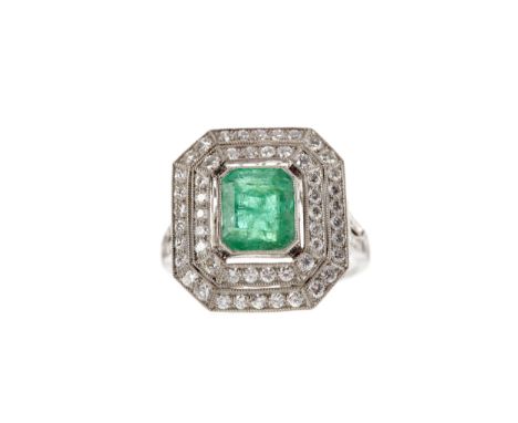 EMERALD AND DIAMOND RING, set with an emerald cut emerald of approximately 1.85 carats within a double halo of round brillian