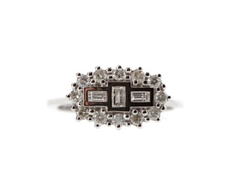 DIAMOND CLUSTER RING, set with three baguette cut diamonds bordered by round brilliant cut diamonds totalling approximately 0