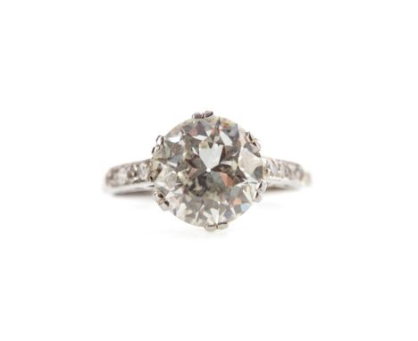 OLD EUROPEAN CUT DIAMOND RING, the diamond of approximately 2.34 carats flanked by four round diamonds to each shoulder, with