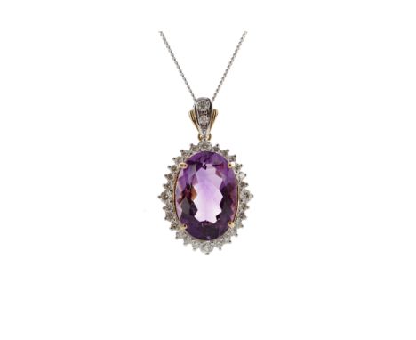 AMETHYST AND DIAMOND PENDANT, set with an oval amethyst within a halo of round brilliant cut diamonds totalling approximately