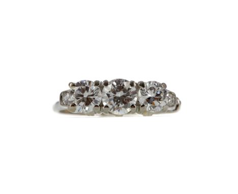 DIAMOND THREE STONE RING, the round brilliant cut diamonds totalling approximately 1.39 carats, flanked by two smaller diamon