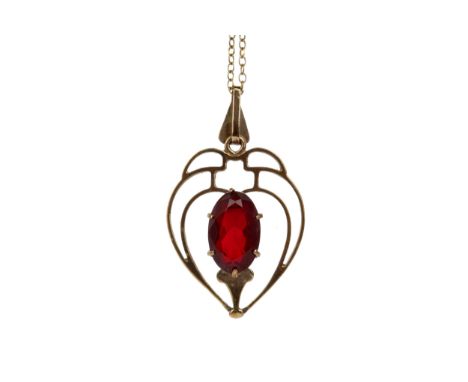RED GEM SET HEART SHAPED PENDANT, with an elongated oval red gem to an openwork heart shaped mount, unmarked, on an unmarked 
