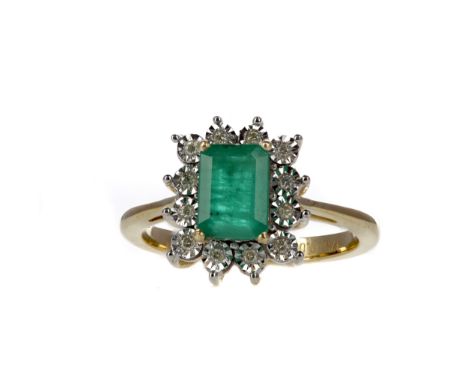 EMERALD AND DIAMOND CLUSTER RING, with an octagonal step cut emerald of approximately 1.03 carats, within an illusion set rou