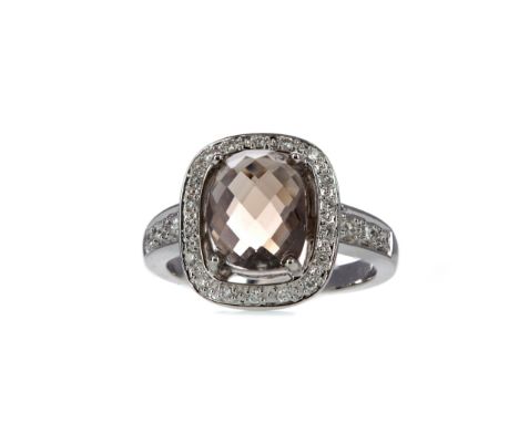 SMOKY QUARTZ AND DIAMOND RING, the faceted cabochon smoky quarts of approximately 3.20 carats within a halo of round brillian