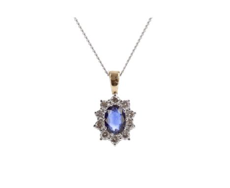 SAPPHIRE AND DIAMOND PENDANT, set with an oval sapphire within a halo of round brilliant cut diamonds totalling approximately