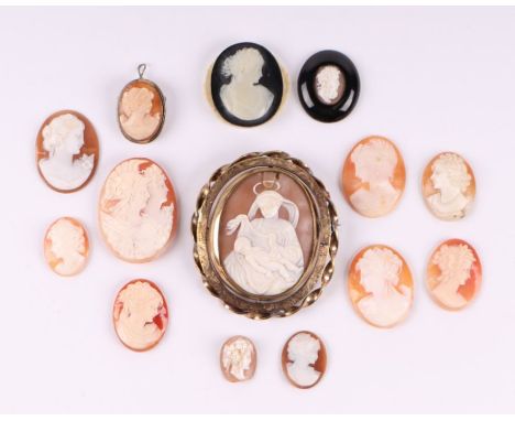 A shell cameo brooch depicting Madonna and child within a Pinchbeck frame, 6cms diameter; together with other shell cameos of