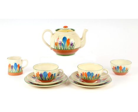 A Clarice Cliff Bizarre Crocus pattern tea set, nine pieces to include teapot.Condition ReportThere is minor surface scratchi