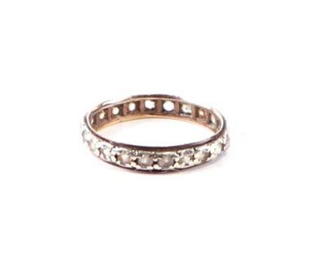 A 9ct gold eternity ring set with white stones, approx UK size 'O', 1.7g.