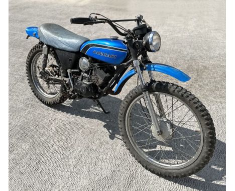 A 1973 Kawasaki KE100 Trail bike for sympathetic commissioning or restoration.  The motorcycle appears in original condition 