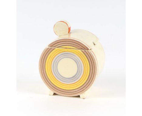 A Clarice Cliff Bizarre jam pot and cover decorated with concentric circles, 10cms high.