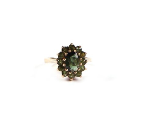 A 9ct gold and peridot cluster ring, approx UK size 'J', 3g.