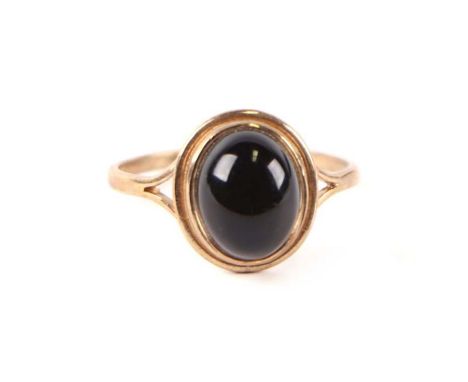 A 9ct gold dress ring set with a smoky quartz cabochon, approx UK size 'M', 1.6g.