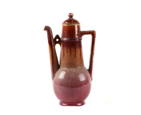 A Linthorpe Pottery high fired coffee pot designed by Dr Christopher Dresser, impressed mark to base, 26cms high (a/f).Condit