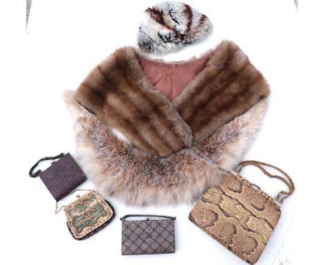 A vintage snakeskin handbag; three ladies evening bags, fur stoles and other items.