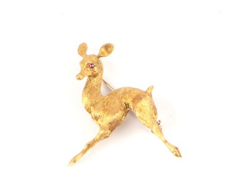 An Italian 18ct gold brooch modelled as a deer with ruby eyes, 9g.