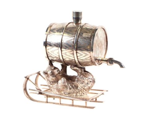 A silver plated spirit flask in the form of a barrel being supported by a bear on a sleigh, 20cms high.