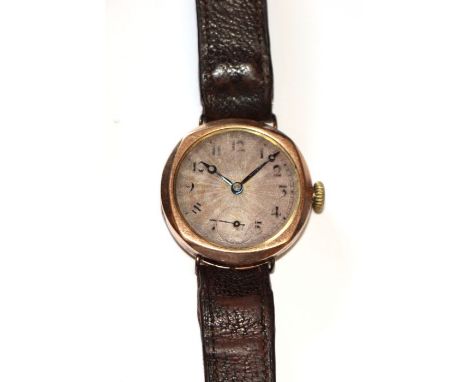 A 1920's Rolco 9ct gold tonneau shaped gentleman's wristwatch, having a silver dial with Arabic numerals, subsidiary seconds 