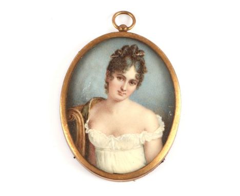 A portrait miniature on ivory depicting a young girl wearing a white dress, framed &amp; glazed, 6.5 by 7cms. (Self-declarati