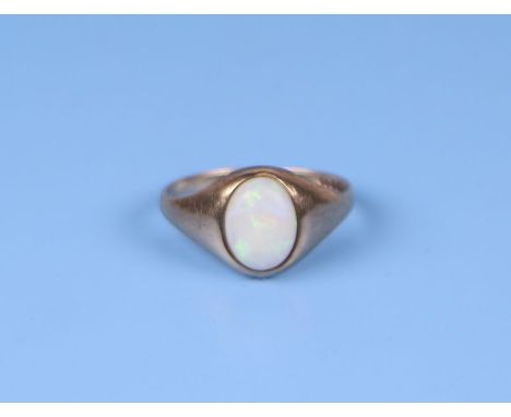 A 9ct gold ring set with an oval opal cabochon, approx UK size 'I', 1.2g.