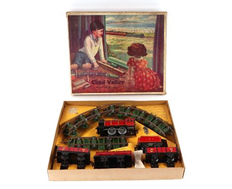 A Chad Valley clockwork tinplate train set containing locomotive and tender, 0-4-0, in LMS livery; together with a CV Motor S