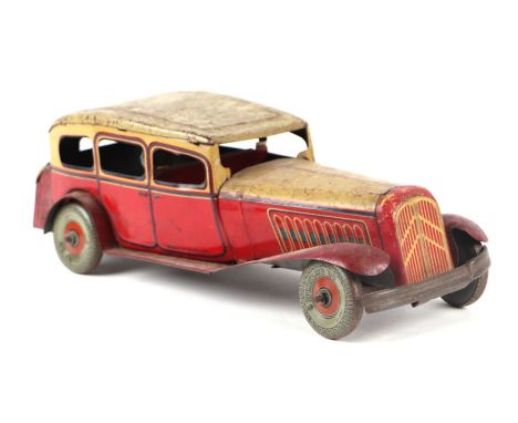 A Mettoy clockwork tinplate sedan car with Dunlop 90 printed wheels, 28cms long.