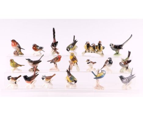 A quantity of Goebel birds to include Greenfinch, Crested Tit and a Beswick Robin and a Beswick Whitethroat.