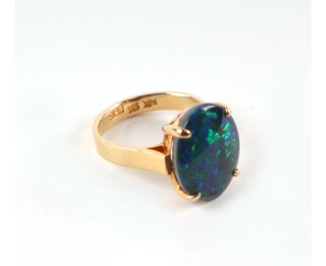 A 14ct gold and black opal cabochon ring, approx UK size 'K', 4.8g.