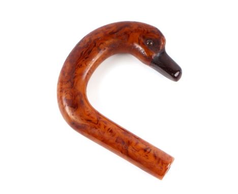 An early plastic amber like walking stick handle in the form of a duck with a cherry amber Bakelite beak, 11cms high.Conditio