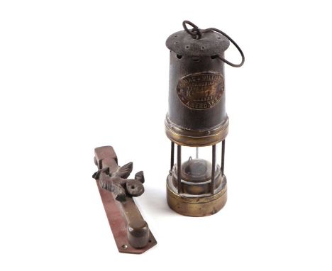 A Thomas &amp; Williams of Aberdare Navy type miner's lamp, 25cms high; together with a brass door knocker with applied Welsh