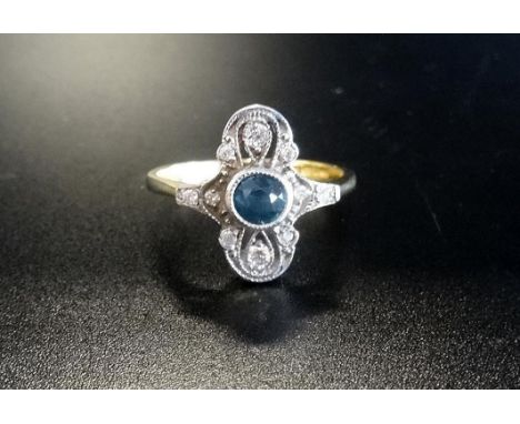 ARTD DECO STYLE BLUE TOPAZ AND DIAMOND PLAQUE RING
the central round cut blue topaz in pierced multi diamond setting, on eigh