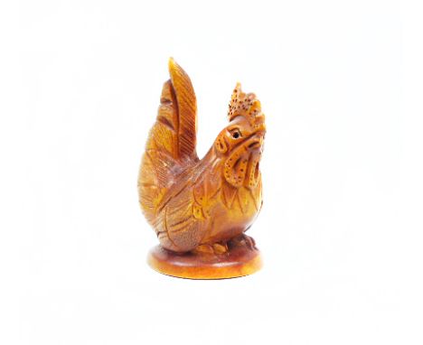 A carved wooden netsuke of a cockerel, signed base.  