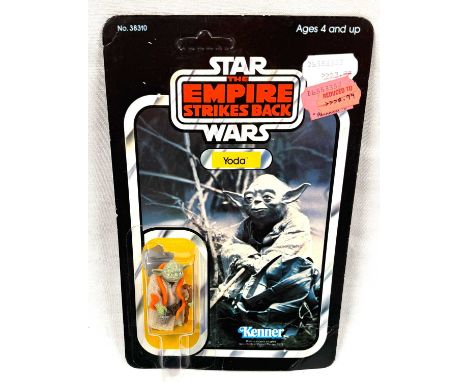 Kenner Star Wars vintage The Empire Strikes Back Yoda (orange snake) 3 3/4" figure, Mint, within Near Mint bubble, upon Fair 