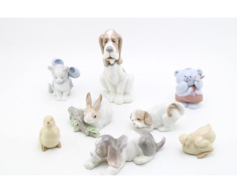 A collection of Lladro animals to include a rabbit on branch, a beagle / hound, with Nao figures such as chicks, dogs and oth