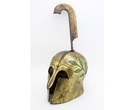 A replica Ancient Greek Spartan helmet. Height 53cm.