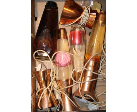 A collection of vintage lava lamps dating from the 1960s and 1970s. With copper bases. Height 44cm. (4)  Untested.
