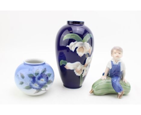 Royal Copenhagen to include a boy seated on a marrow, a floral vase 1886 and a small bulbous vase 2390 (3).  In good conditio