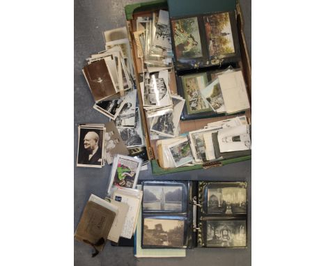 A large mixed collection of antique and vintage postcards to include two folders together with loose postcards. (Qty)