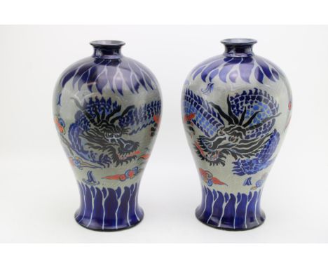 A near pair of large Royal Cauldon baluster vases, with dragon design, grey backgroud, probably Frederick Rhead, 35cm tall (2