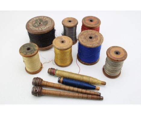 A collection of vintage and antique bobbins and threads together with a quantity of bobbin spools. (Qty)