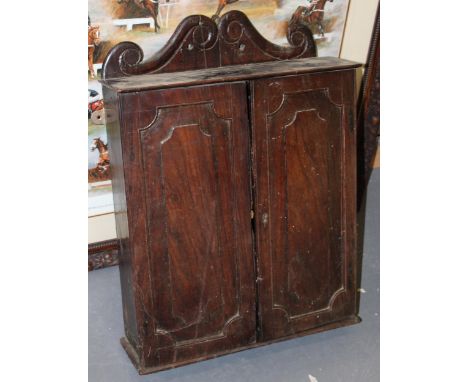 A 19th century cuban mahogany wall cabinet with two internal drawers, pigeon holes and shelf. Height 60cm, depth 15cm, width 