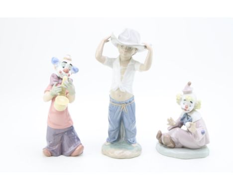 Nao figures to include a clown saxophonist, a clown with a ball and a cowboy (3), tallest 26cm tall.  In good condition with 