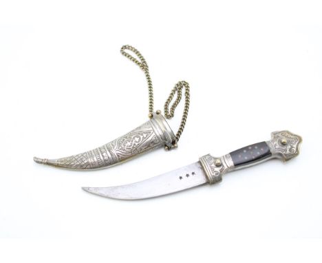 An Eastern Kharijar dagger and scabbard with nickel belt and chains, nickel plated brass handle inset with ebony. Three impre