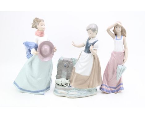 Three large Nao figurines to include a girl with a broken vase, a girl holding her hat and a girl with an umbrella (3) talles