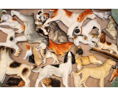 A collection of ceramic dogs by Cooper Craft and other similar manufacturers. (Qty)  In good condition.